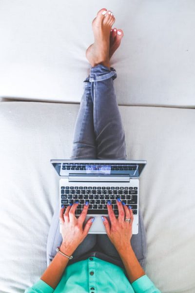 hands-woman-legs-laptop